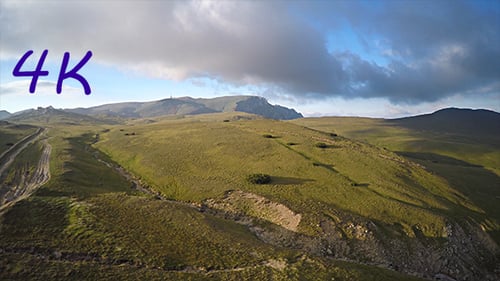 Aerial View of Green Rolling Hills Landscape