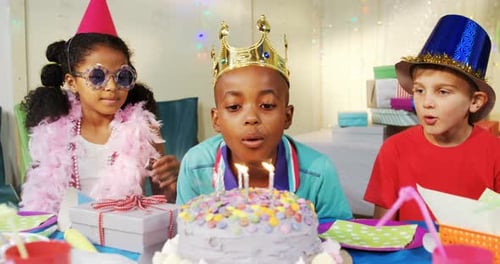 Children Celebrate with Birthday Cake and Party Hats