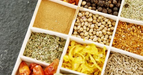 Colorful Selection of Spices and Herbs in Container