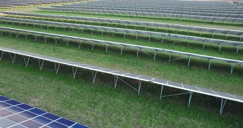 Solar Panels of a Modern Power Plant in the Evening at Sunset
