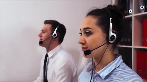 Customer Service Representatives Wearing Headsets at Work