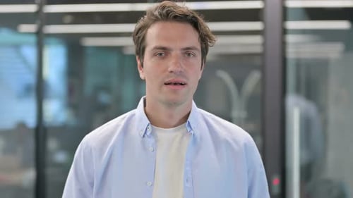 Young Adult Man Portrait in Office Environment