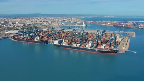 Aerial View. International Port with Crane Loading Containers in Import Export Business Logistics.