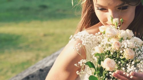 Young Bride with Flower Crown Holding Bouquet