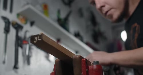 Carpenter Uses Hand Plane for Wood Processing at His Workshop
