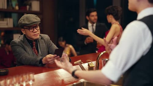 4K Group of People enjoy hangout nightlife at luxury bar.