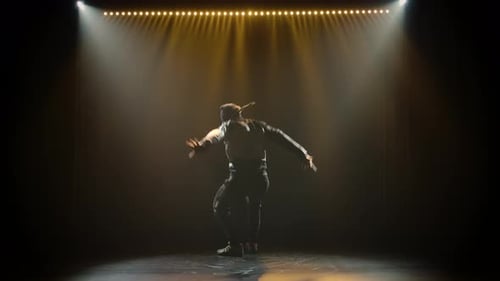 Young Handsome Guy in Tracksuit Vigorously Dancing Break Dance, Freestyle, Street Dance, Performs