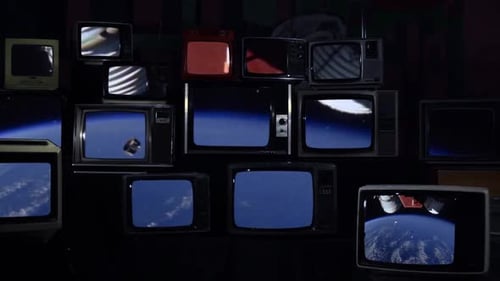 Dynamic Array of Vintage Televisions Broadcasting Space Footage