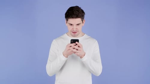 Man Reacts with Joy to Mobile Phone News