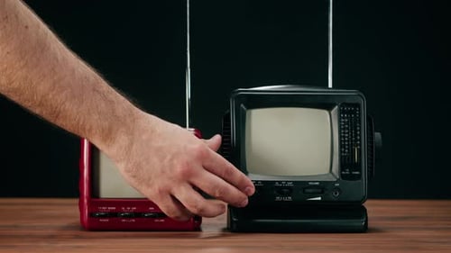 Tuning Two Retro Style Miniature Television Sets