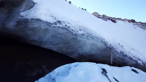 Ice Cave in the Snowy Mountains