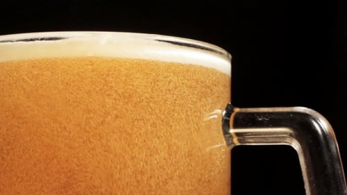 Close Up of Beer Being Poured into Mug