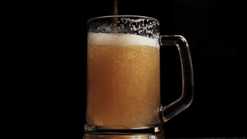 Craft Beer Pouring Into Glass Mug