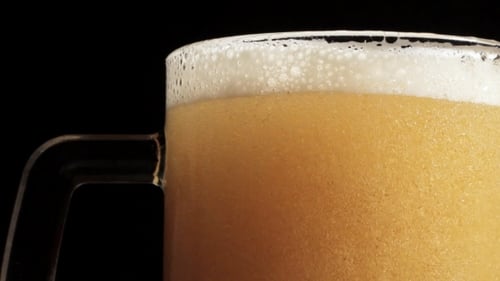 Craft Beer Being Poured into Glass Mug