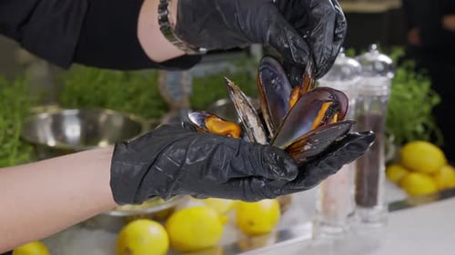Chef in Gloves Preparing Mussels