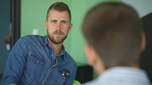 a Young Student Listens Carefully To The Teacher