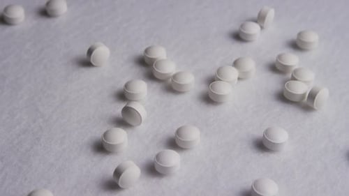 Close-up of Scattered White Pills