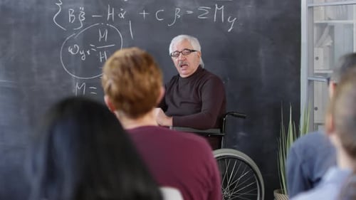 Teacher Explains Math Formula to Students in Classroom
