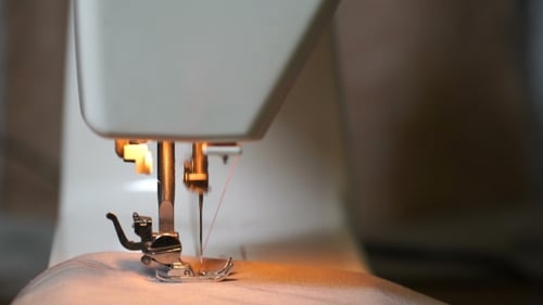 Sewing Machine Needle Stitching Fabric Close Up