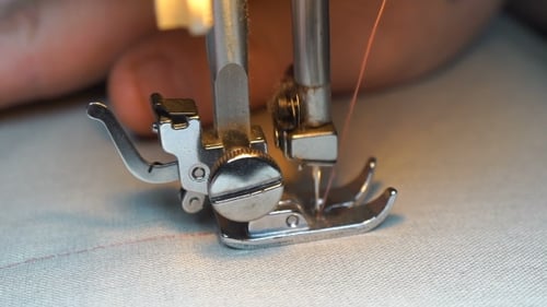 Sewing Machine Stitching White Fabric Close Up