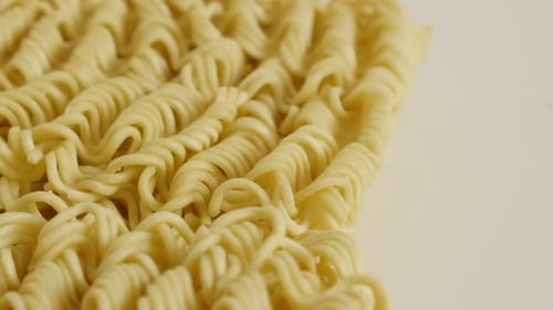Dry Noodles on a White Surface
