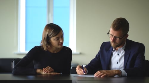 Businesswoman Signing Contract At Interview In Office