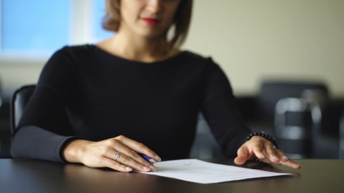Young Business Woman Signing Contract