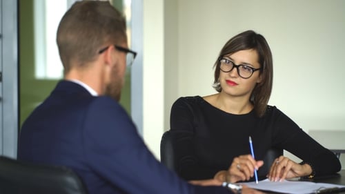 Business Meeting Between Man and Woman at Office