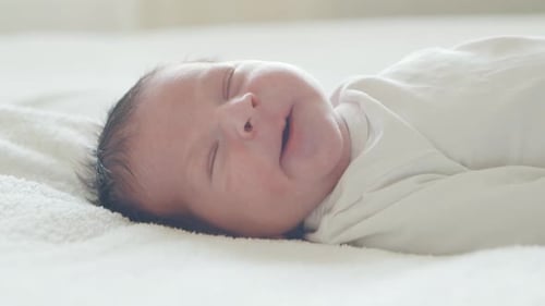 Close-up portrait of a young baby who has recently been born.