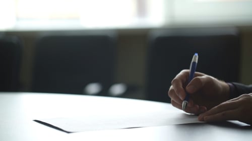 Businessman's Hand Signing Document. Man Signs Paper Beside Window. New Insurance Policy. Official