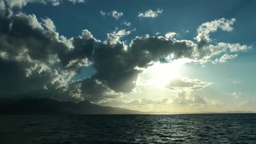 Clouds and Sun Rays over Winter Sea