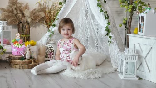 Cute Child Petting Rabbit Indoors
