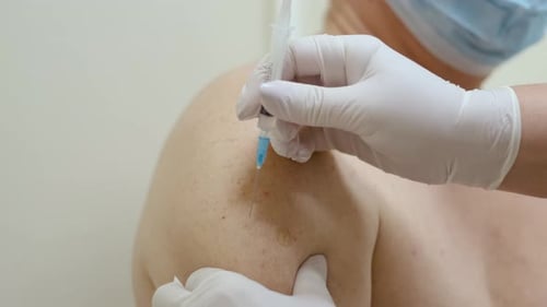 Injection into Upper Arm in a Hospital Setting