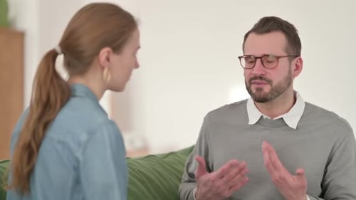 Man Talking to a Woman on a Couch
