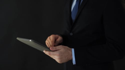 Businessman In Suit Working With Tablet Pc