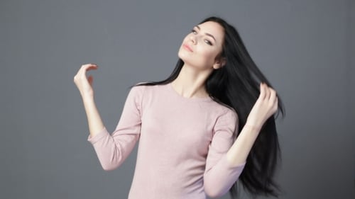 Attractive Woman Posing with Long, Black Hair