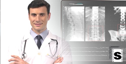 Man Smiles in Medical Office with X-Rays