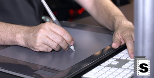 Hands Using Digital Drawing Tablet and Stylus