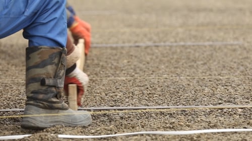 Workers Leveled Gravel
