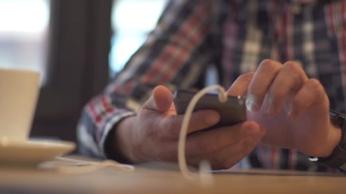 Of a Student Man Using Smart Phone Cafe