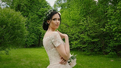 Beautiful Woman in Dress Posing Outdoors