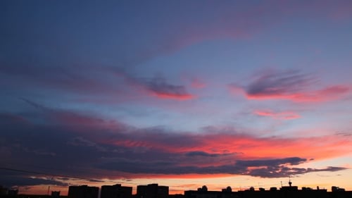 Dramatic Sunrise Over City Skyline Time-Lapse