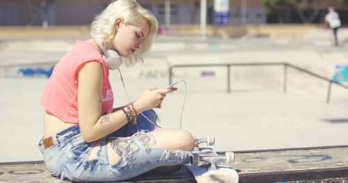 Trendy Young Blond Woman At a Skate Park
