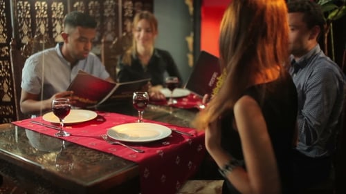 People Are Talking In The Indian Restaurant