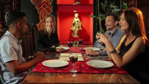 Guy Are Communicates With Friends In Restaurant
