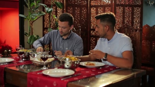 Men Are Eating In The Indian Restaurant