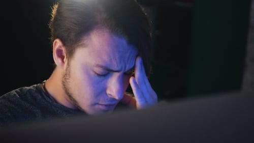 Caucasian Businessman Working Late in the Office and Feel Headache. Tired Freelancer Have a Problem