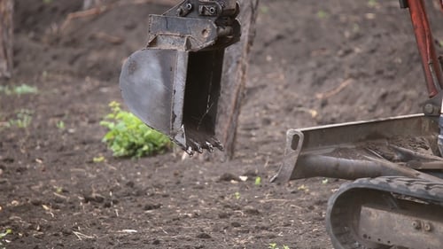 Excavator Digging in the Dirt