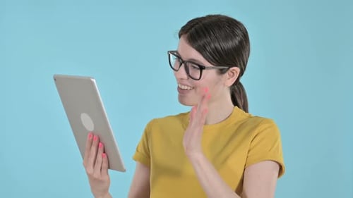 Young Adult Woman Video Chatting With a Tablet