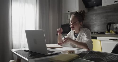 Woman Working From Home During Video Conference